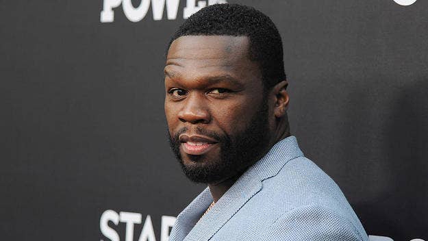 Watch a video clip of 50 Cent, alongside Jay Manzini, giving away more than $30,000 cash to Burger King employees at a drive-thru in Queens.