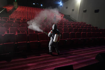 Cleaning between screenings at a Chinese cinema.