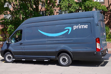 View of an Amazon delivery van parked at an apartment complex in Chicago.