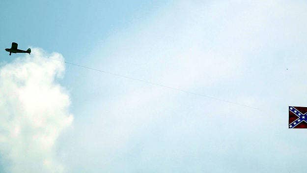 Prior to a race on Sunday, a protestor apparently upset with NASCAR's ban on confederate flags flew a 'Defund NASCAR' sign over Talladega Superspeedway.
