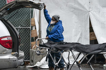 Funeral worker prepares for retrieving deceased body