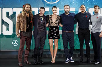 'Justice League' cast pose for a photograph at a photocell.