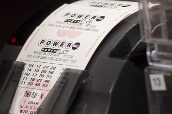 A machine prints Powerball tickets.