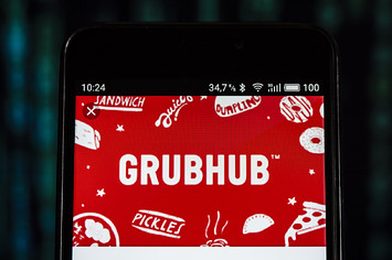 On this photo illustration, the GrubHub logo