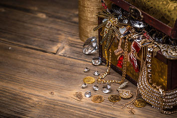 Treasure chest on wooden background.