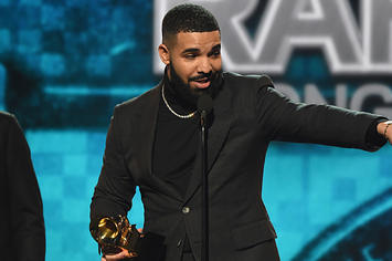 Drake accepting a Grammy Award for "Best Rap Song."