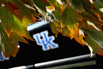 The fall colors frame a University of Kentucky logo.