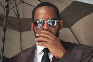 R&B singer R. Kelly covers his mouth