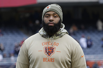 Akiem Hicks stands on the field prior to a game against the Detroit Lions.