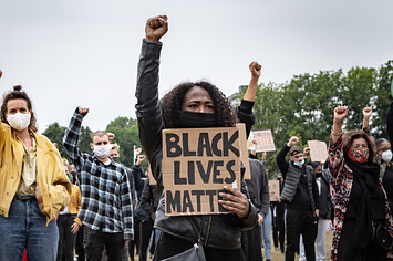 Protesters take part in a demonstration against police brutality and racism.