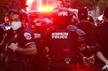 Protesters are taken after being arrested by Washington D.C. Metropolitan Police officers.