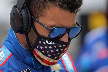 Bubba Wallace stands on the grid prior to the NASCAR Cup Series GEICO 500.