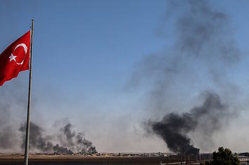 Dark smoke rises at the site of Tell Abyad city of Syria after terrorists burnt tires