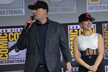 Kevin Feige and Scarlett Johansson speak on stage for the Marvel panel of Comic Con.