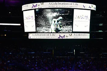 A screen shows photos during the "Celebration of Life for Kobe and Gianna Bryant" service