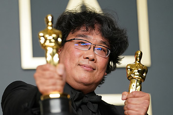 Bong Joon ho poses in the press room during the 92nd Annual Academy Awards.