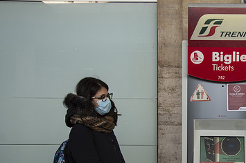 Train passenger with masks during sanitary checks on March 08, 2020
