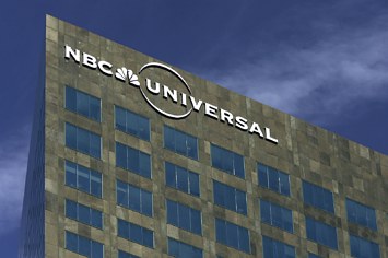 NBC Universal logo hangs on its headquarters.
