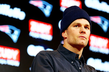 Tom Brady #12 of the New England Patriots speaks with the media.