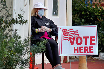 A poll worker at the First Baptist Church voting site in Hollywood, Fla.