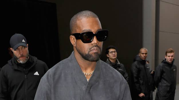 Kanye's pop-up performance was followed by his Yeezy Season 8 fashion show.