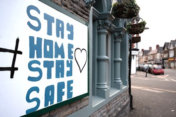 A sign implores UK residents to 'stay home stay safe.'