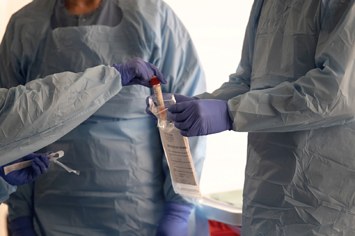 Nurses in Washington handle coronavirus test viles.