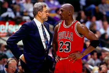 Michael Jordan discusses strategy with head coach Phil Jackson