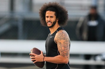 Colin Kaepernick looks to make a pass during a private NFL workout