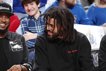 J. Cole watches the game between the Detroit Pistons and Dallas Mavericks.
