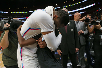Dwyane Wade hugs his son, Zion, after a 91 85 win against the Milwaukee Bucks.