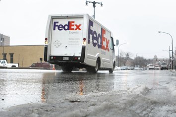 A FedEx truck makes the rounds during the 2014 holiday season.