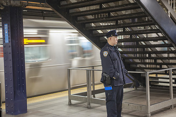 An NYPD officer is seen in the Times Square station in New York.