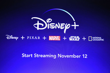A screen announcing the Disney+ streaming service is seen at the D23 Expo