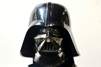 A Darth Vader helmet and mask from the film "The Empire Strikes Back" on display