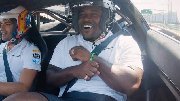ASAP Ferg freestyles on a Budapest racetrack while riding shotgun with F1 racer Carlos “Chilly” Sainz in a McLaren 720S.
