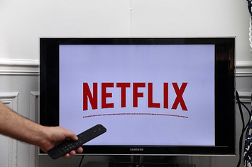 The Netflix media service provider's logo is displayed on the screen of a television.