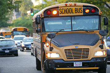A school bus drives on Geneva Avenue
