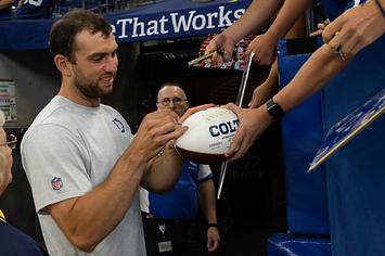 Andrew Luck signs autographs for Colts fans during the 2019 preseason.
