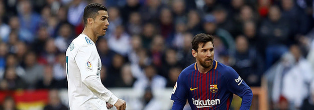 Lionel messi and cristiano ronaldo in a playful moment