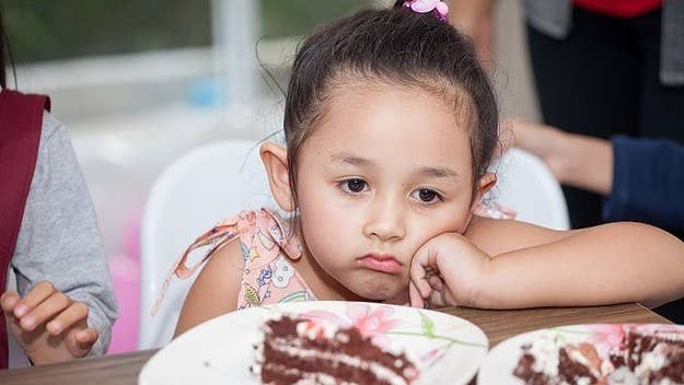 A mom shared the hilarious photos of her toddler looking at the rude cake.