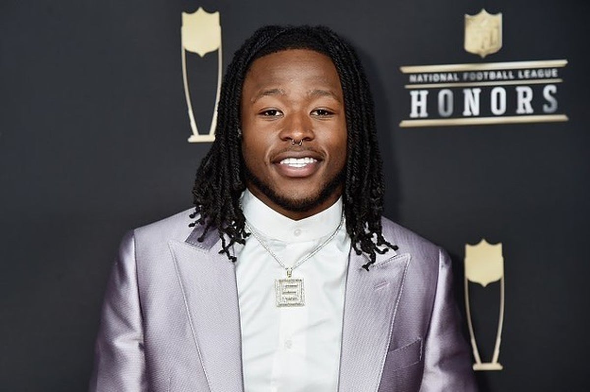 Alvin Kamara wears 49ers jersey, 'Make Africa Home Again' hat