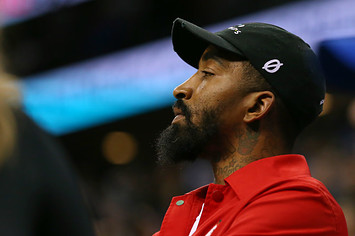 Former NBA player J.R. Smith watches a game