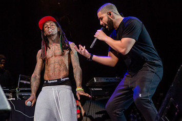 Lil Wayne (L) and Drake perform at Lil Weezyana Festival