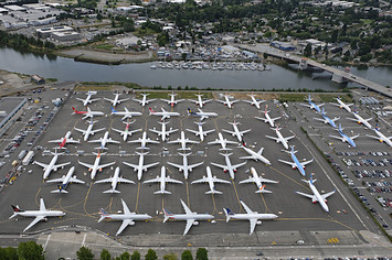 Boeing 737 MAX airplanes are stored on employee parking lots near Boeing Field.