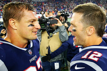 Tom Brady #12 talks to Rob Gronkowski #87 of the New England Patriots