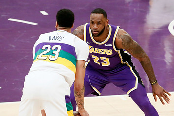 LeBron James #23 of the Los Angeles Lakers plays defense against Anthony Davis