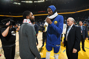 Kyrie Irving #11 of the Boston Celtics speaks with Kevin Durant #35 of the Golden State Warriors