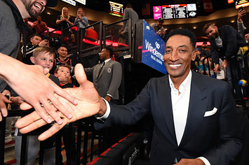 NBA legend Scottie Pippen high fives a fan before Game Four of the Western Conference Finals