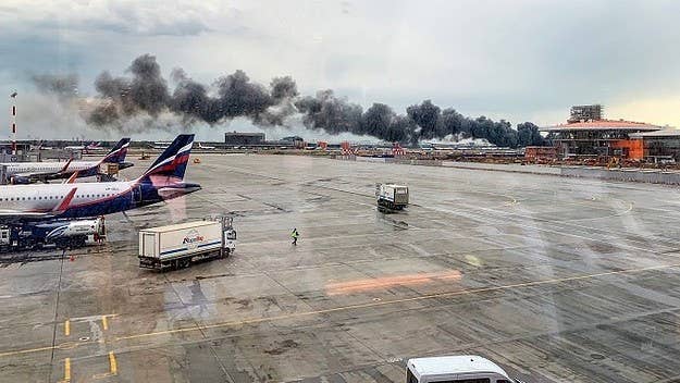 A Russian plane carrying 78 passengers burst into flames after an emergency landing at a Moscow airport.